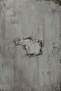 A piece of concrete with a hole in it
